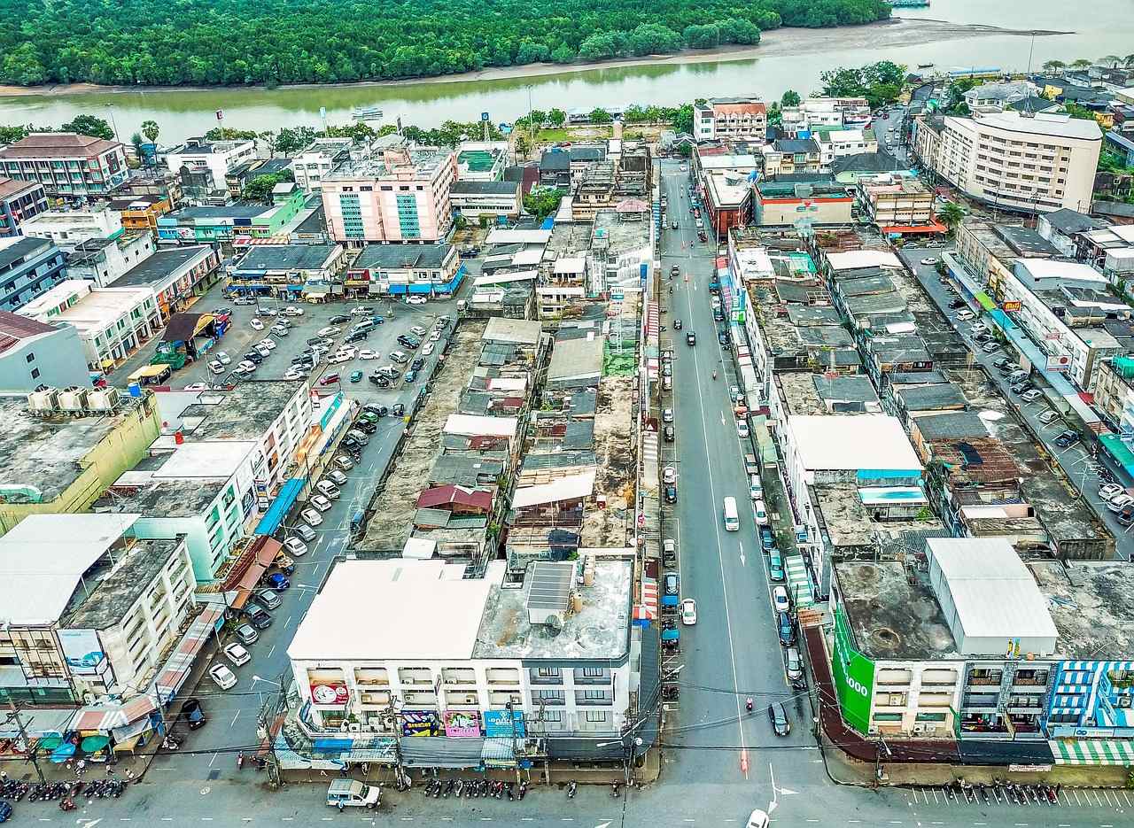 Cars and buildings along a street in Krabi town