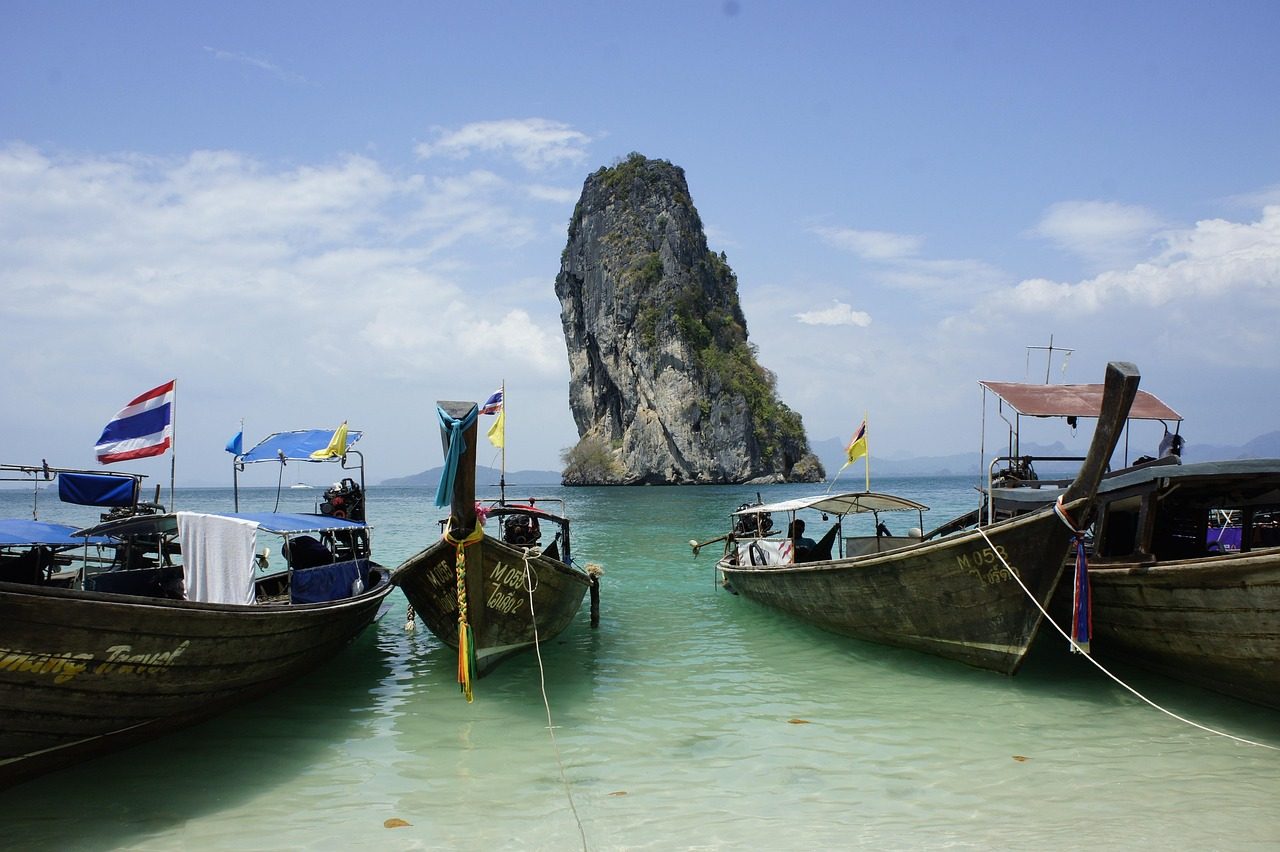 Longtail boats moored on a beach along the Andaman coast